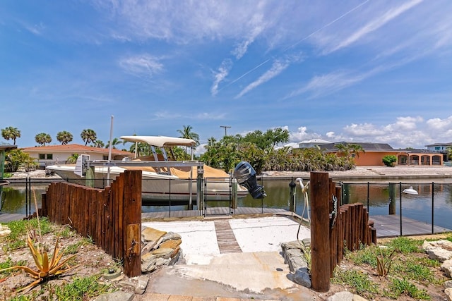 view of patio featuring a boat dock and a water view