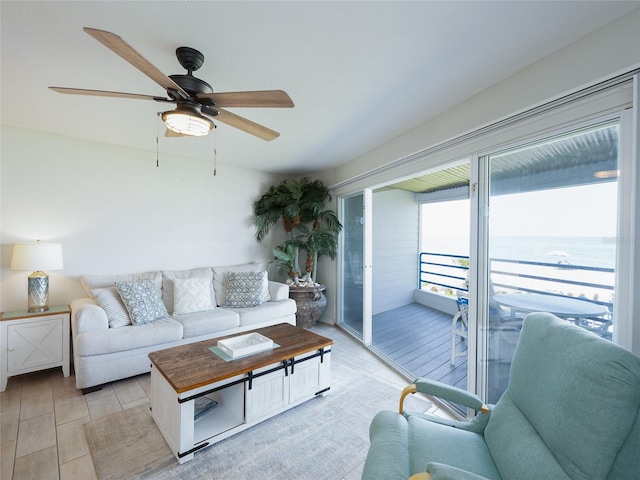 2400 N Beach Rd Unit 1, Englewood, FL 34223 - living room with a ceiling fan, a water view, and light wood-style floors