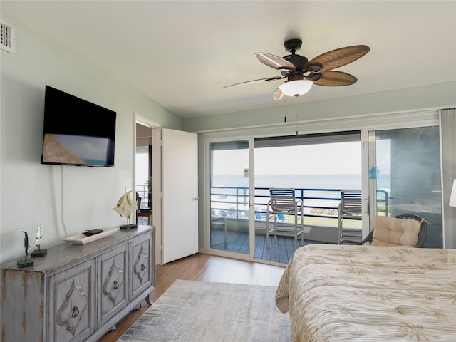 2400 N Beach Rd Unit 1, Englewood, FL 34223 - bedroom featuring access to exterior, wood finished floors, and ceiling fan