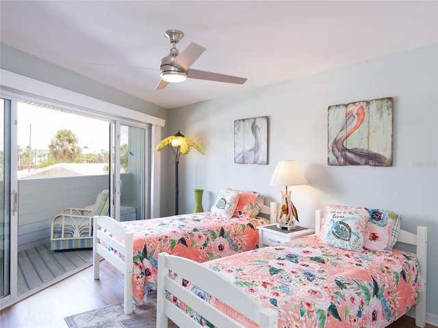 2400 N Beach Rd Unit 1, Englewood, FL 34223 - bedroom featuring access to exterior, wood finished floors, and a ceiling fan