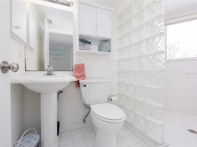 2400 N Beach Rd Unit 1, Englewood, FL 34223 - bathroom with walk in shower, toilet, and tile patterned flooring
