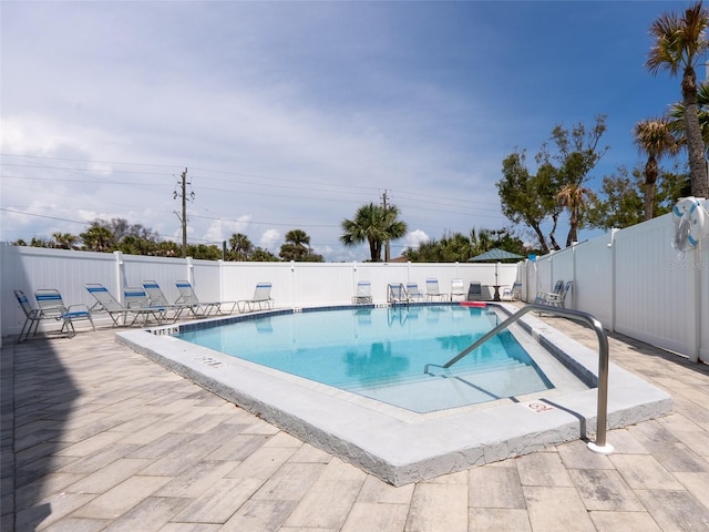 2400 N Beach Rd Unit 1, Englewood, FL 34223 - community pool featuring a fenced backyard and a patio area