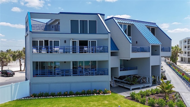 2400 N Beach Rd Unit 1, Englewood, FL 34223 - back of house with metal roof, a standing seam roof, and fence