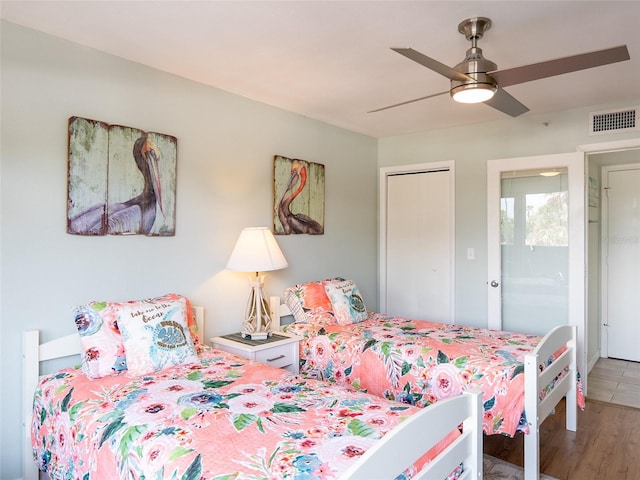 2400 N Beach Rd Unit 1, Englewood, FL 34223 - bedroom featuring wood finished floors, a ceiling fan, and a closet