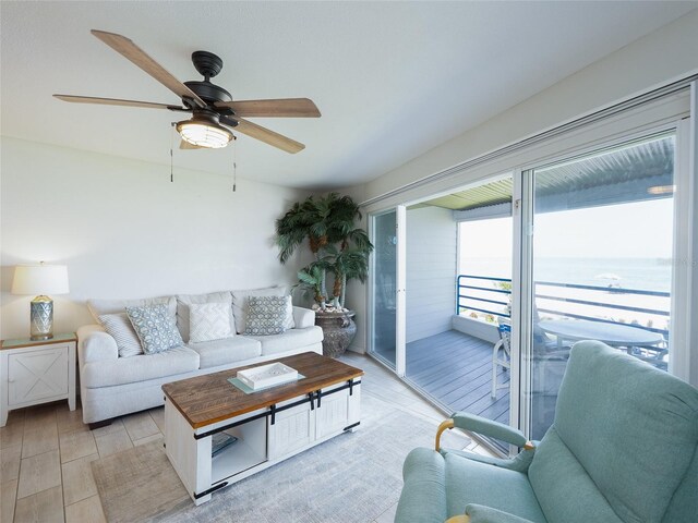 2400 N Beach Rd Unit 1, Englewood, FL 34223 - living area featuring a ceiling fan and a water view
