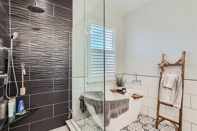 11367 Perico Isle Cir, Bradenton, FL 34209 - bathroom featuring a walk in shower, a soaking tub, and tile walls