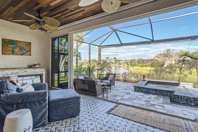 11367 Perico Isle Cir, Bradenton, FL 34209 - view of patio / terrace featuring ceiling fan, an outdoor hangout area, an in-ground hot tub, a lanai, and a water view
