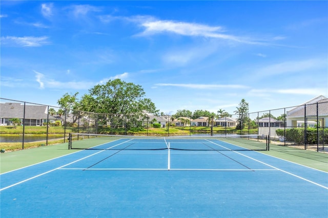 11367 Perico Isle Cir, Bradenton, FL 34209 - view of tennis court featuring fence and a residential view