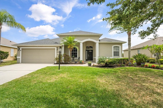 2808 124th Ave E, Parrish, FL 34219 - mediterranean / spanish-style house featuring a garage, driveway, and a front lawn