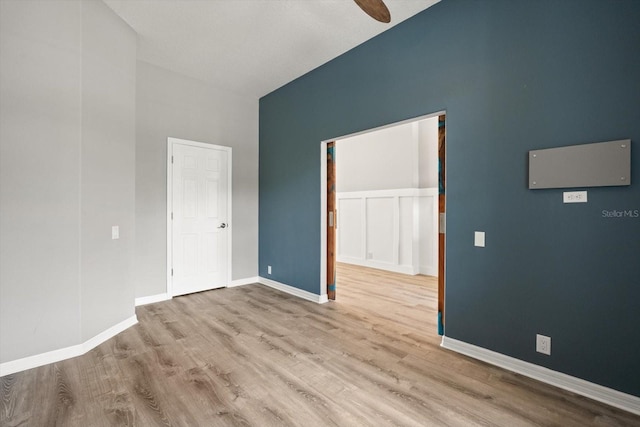 2808 124th Ave E, Parrish, FL 34219 - unfurnished bedroom featuring high vaulted ceiling, wood finished floors, and a ceiling fan