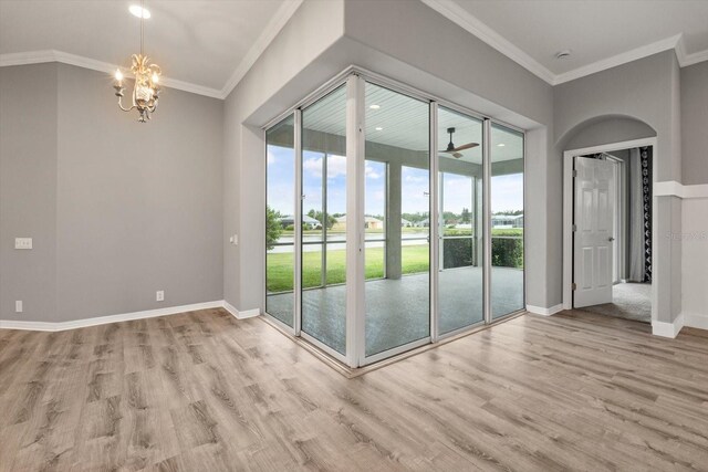 2808 124th Ave E, Parrish, FL 34219 - spare room with wood finished floors, a chandelier, ornamental molding, a ceiling fan, and recessed lighting