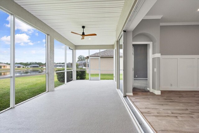 2808 124th Ave E, Parrish, FL 34219 - unfurnished sunroom with a water view and a ceiling fan