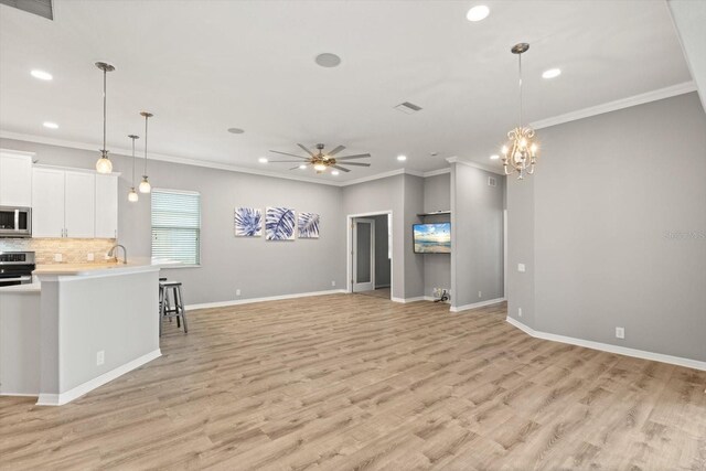 2808 124th Ave E, Parrish, FL 34219 - kitchen with appliances with stainless steel finishes, recessed lighting, light countertops, light wood-style floors, and ceiling fan