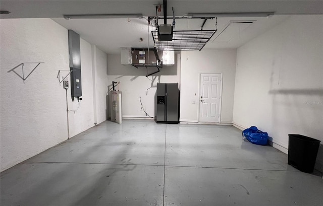 2808 124th Ave E, Parrish, FL 34219 - garage featuring black refrigerator with ice dispenser, water heater, and a garage door opener