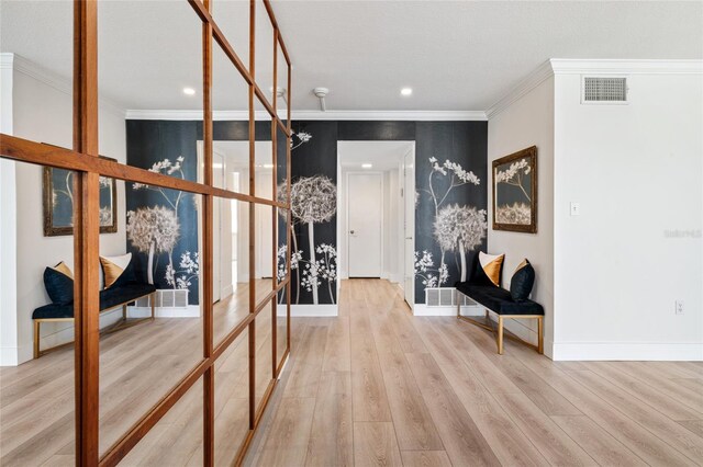 hallway with wood finished floors, crown molding, baseboards, and recessed lighting