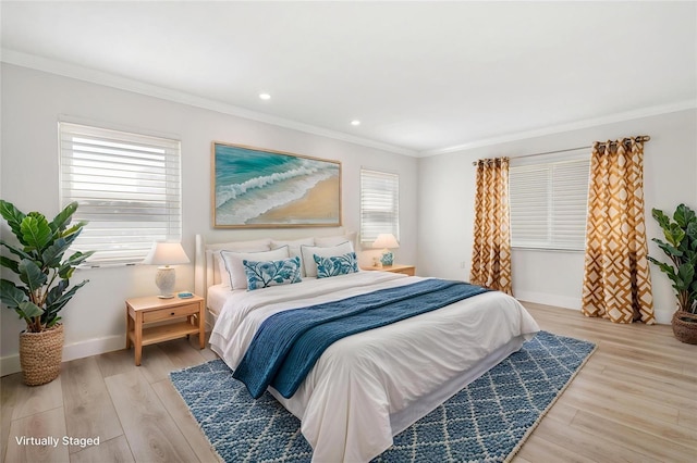 bedroom featuring ornamental molding, light wood finished floors, baseboards, and recessed lighting