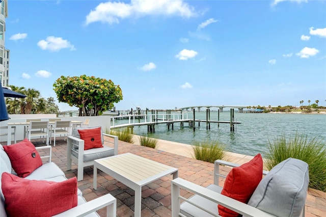 dock with a water view and a patio