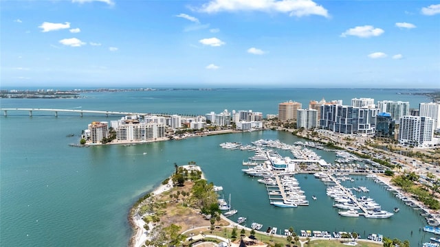 view of urban area featuring a nearby body of water and a marina