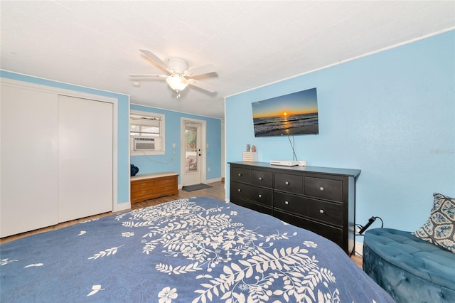 2004 19th St W, Bradenton, FL 34205 - bedroom with wood finished floors, cooling unit, baseboards, a ceiling fan, and a closet