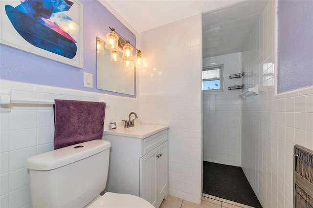 2004 19th St W, Bradenton, FL 34205 - bathroom featuring tile walls, a walk in shower, toilet, vanity, and heating unit