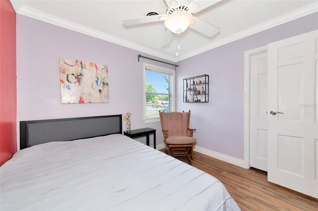 2004 19th St W, Bradenton, FL 34205 - bedroom with wood finished floors, baseboards, crown molding, and a ceiling fan