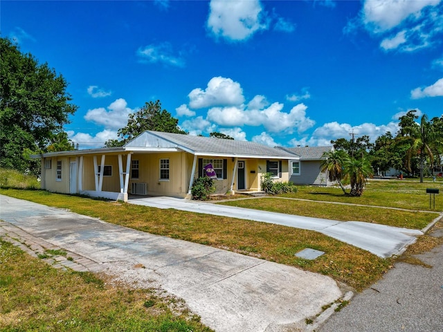 2004 19th St W, Bradenton, FL 34205 - ranch-style home with a front lawn, concrete driveway, and covered porch