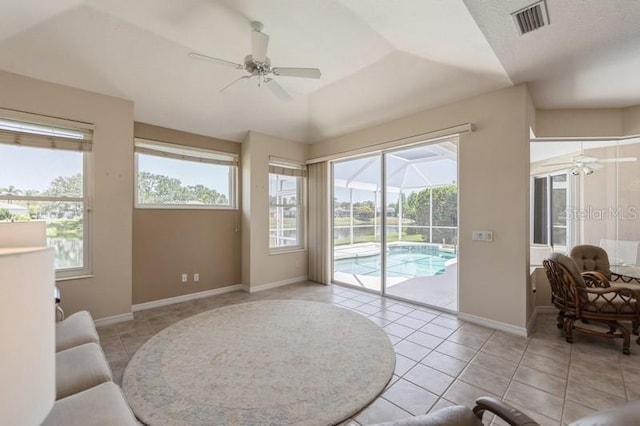 12007 Clubhouse Dr, Lakewood Ranch, FL 34202 - living area with a ceiling fan, a sunroom, and plenty of natural light