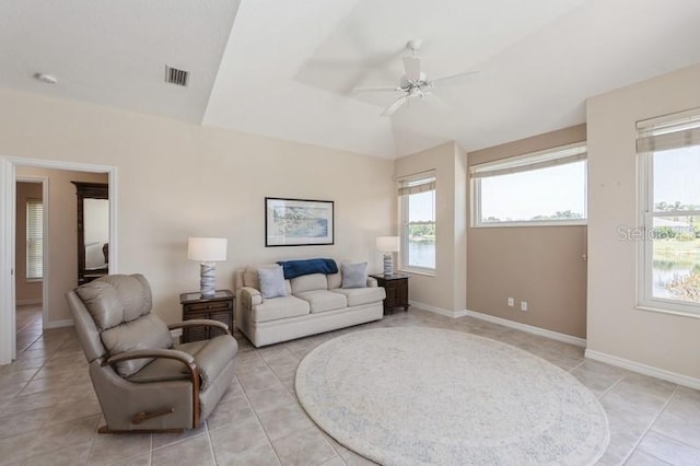 12007 Clubhouse Dr, Lakewood Ranch, FL 34202 - living area featuring plenty of natural light, ceiling fan, lofted ceiling, and light tile patterned floors