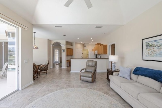 12007 Clubhouse Dr, Lakewood Ranch, FL 34202 - living room featuring light tile patterned floors, baseboards, a ceiling fan, arched walkways, and recessed lighting