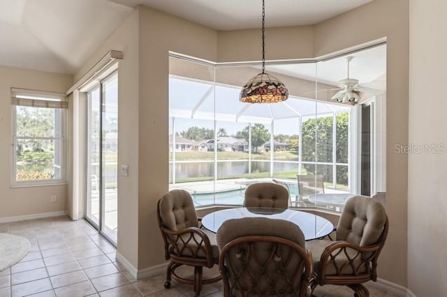 12007 Clubhouse Dr, Lakewood Ranch, FL 34202 - dining room with baseboards, a water view, light tile patterned floors, and ceiling fan