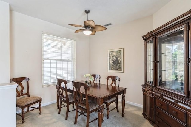 12007 Clubhouse Dr, Lakewood Ranch, FL 34202 - dining room with light carpet, ceiling fan, and baseboards
