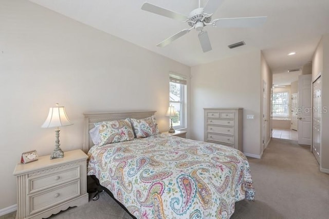 12007 Clubhouse Dr, Lakewood Ranch, FL 34202 - bedroom featuring multiple windows, light colored carpet, baseboards, and recessed lighting