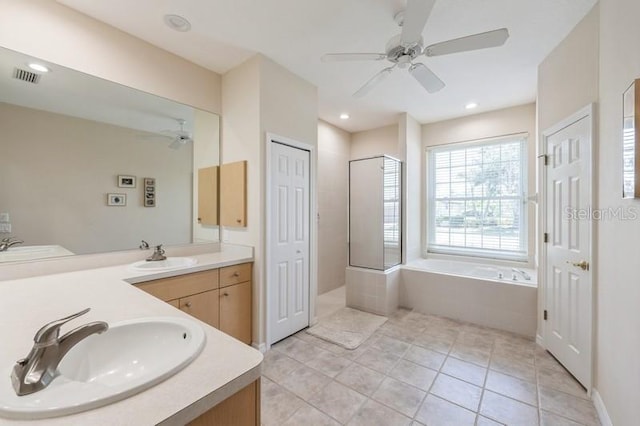 12007 Clubhouse Dr, Lakewood Ranch, FL 34202 - bathroom featuring a ceiling fan, a garden tub, double vanity, tile patterned floors, and walk in shower