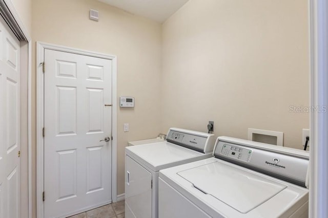 12007 Clubhouse Dr, Lakewood Ranch, FL 34202 - laundry room featuring washing machine and dryer and light tile patterned floors