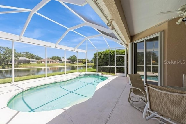 12007 Clubhouse Dr, Lakewood Ranch, FL 34202 - outdoor pool with a patio, a water view, a ceiling fan, and glass enclosure