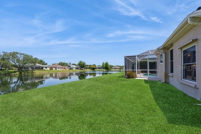 12007 Clubhouse Dr, Lakewood Ranch, FL 34202 - view of green lawn featuring a water view and a lanai