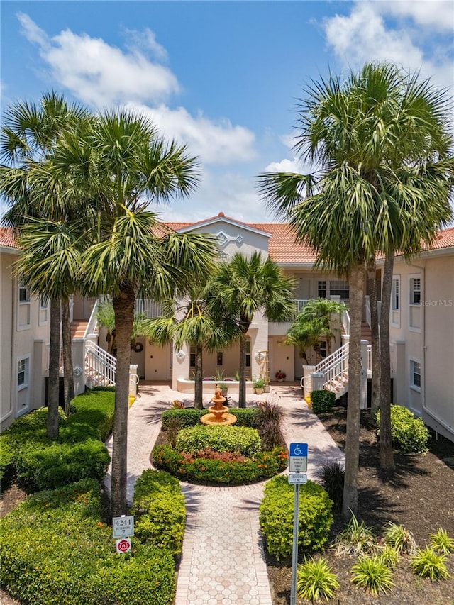 view of property's community featuring stairs