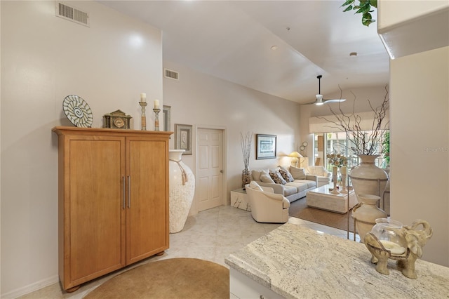 living room with vaulted ceiling and a ceiling fan