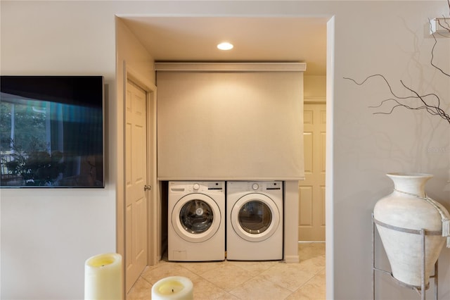 laundry area with washing machine and dryer, tile patterned floors, and recessed lighting