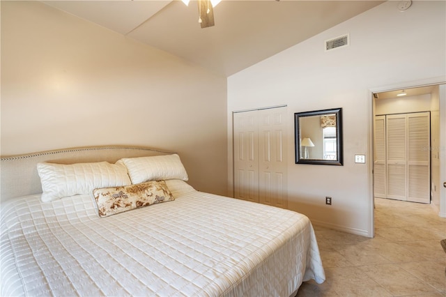 bedroom featuring high vaulted ceiling, light tile patterned flooring, baseboards, ceiling fan, and a closet