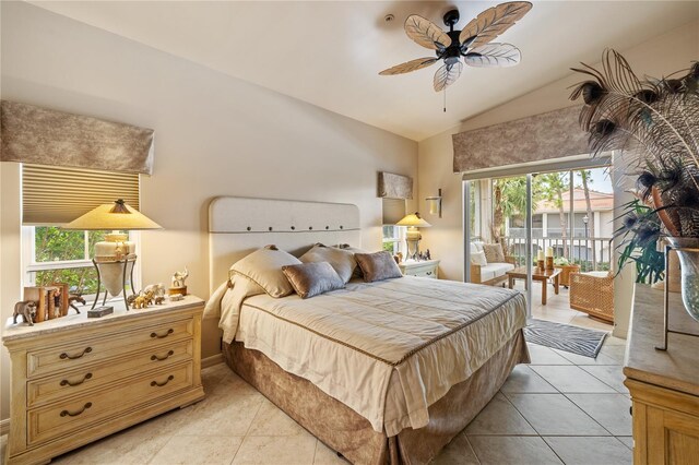 bedroom featuring access to outside, lofted ceiling, light tile patterned floors, and a ceiling fan