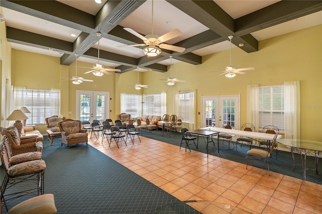 common area with coffered ceiling, a high ceiling, beam ceiling, and recessed lighting