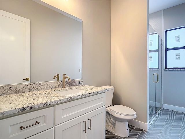 7152 Bougainvillea St, Englewood, FL 34224 - full bath with vanity, a stall shower, toilet, and tile patterned floors