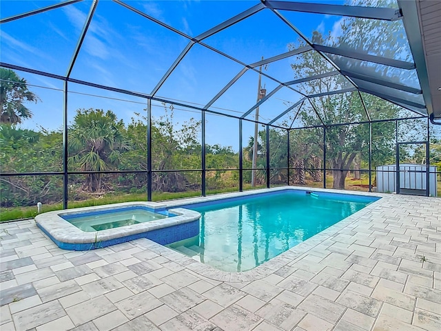 7152 Bougainvillea St, Englewood, FL 34224 - view of swimming pool featuring a patio area, a pool with connected hot tub, and glass enclosure