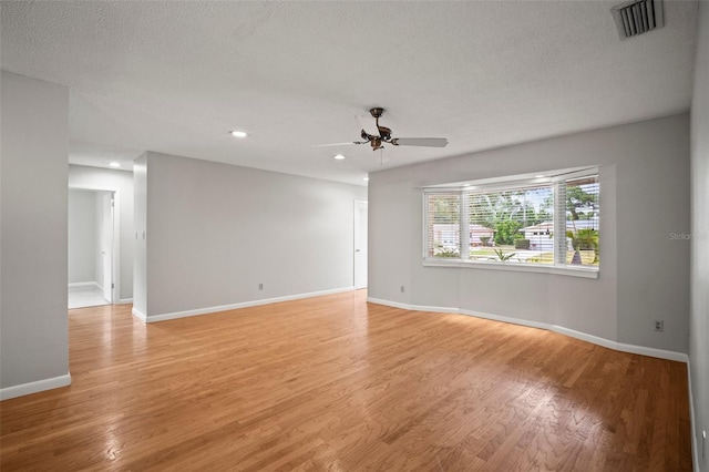 6512 Bowline Dr, Sarasota, FL 34231 - spare room featuring a ceiling fan, light wood-style floors, baseboards, recessed lighting, and a textured ceiling