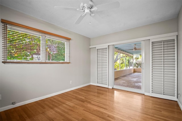 6512 Bowline Dr, Sarasota, FL 34231 - spare room featuring ceiling fan, plenty of natural light, and wood finished floors