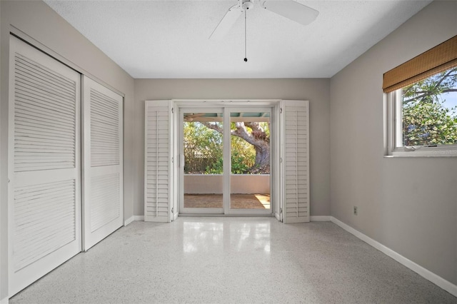 6512 Bowline Dr, Sarasota, FL 34231 - unfurnished dining area featuring speckled floor, a ceiling fan, and baseboards