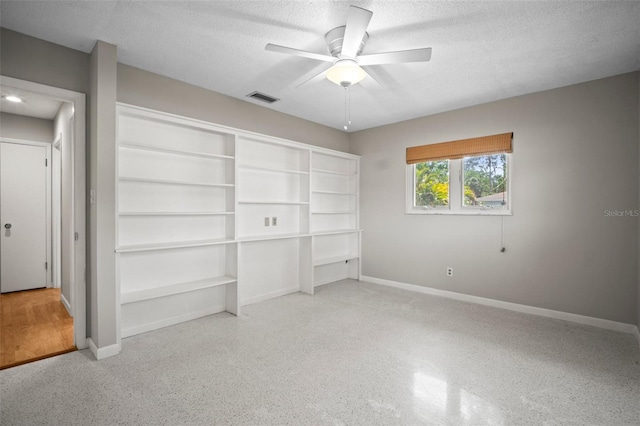 6512 Bowline Dr, Sarasota, FL 34231 - unfurnished bedroom featuring baseboards, speckled floor, a textured ceiling, a ceiling fan, and a closet