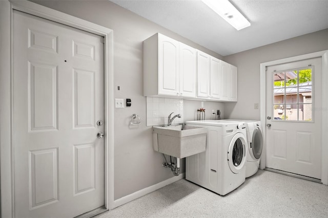 6512 Bowline Dr, Sarasota, FL 34231 - clothes washing area with cabinet space, washing machine and clothes dryer, and baseboards