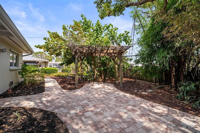 6512 Bowline Dr, Sarasota, FL 34231 - view of patio / terrace with a pergola and fence